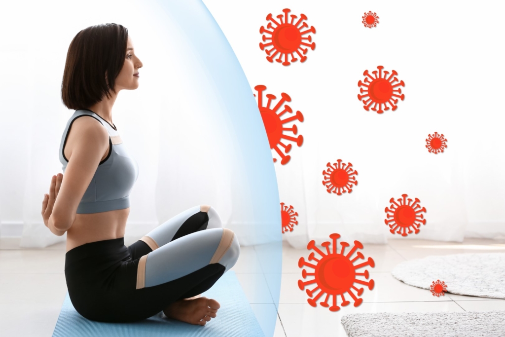 Young woman practicing yoga at home. Concept of strong immunity
