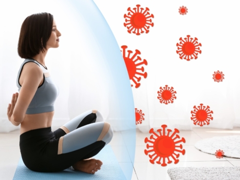 Young woman practicing yoga at home. Concept of strong immunity