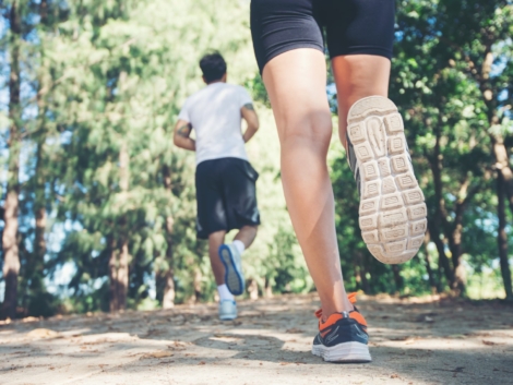 Young couple running in the park.